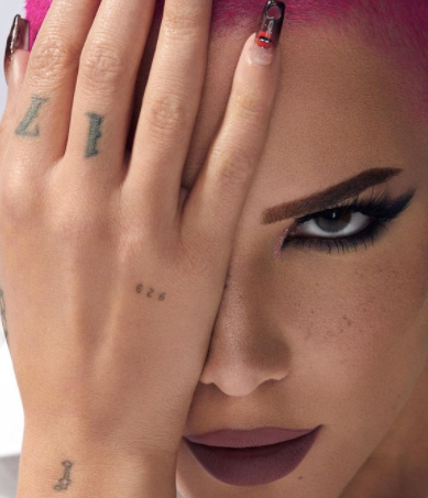 Halsey tattoos: Hand and knuckle tattoos