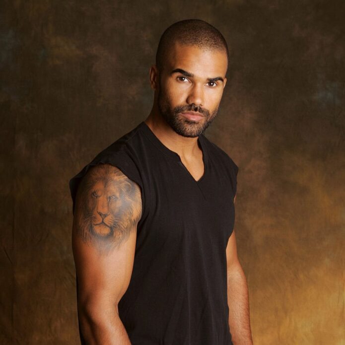 Shemar Moore’s lion tattoo clearly visible on his shoulder in a sleeveless portrait