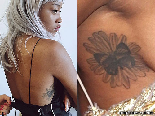 Keke Palmer tattoos: large butterfly and flower tattoo on the right side of Keke Palmer’s ribcage