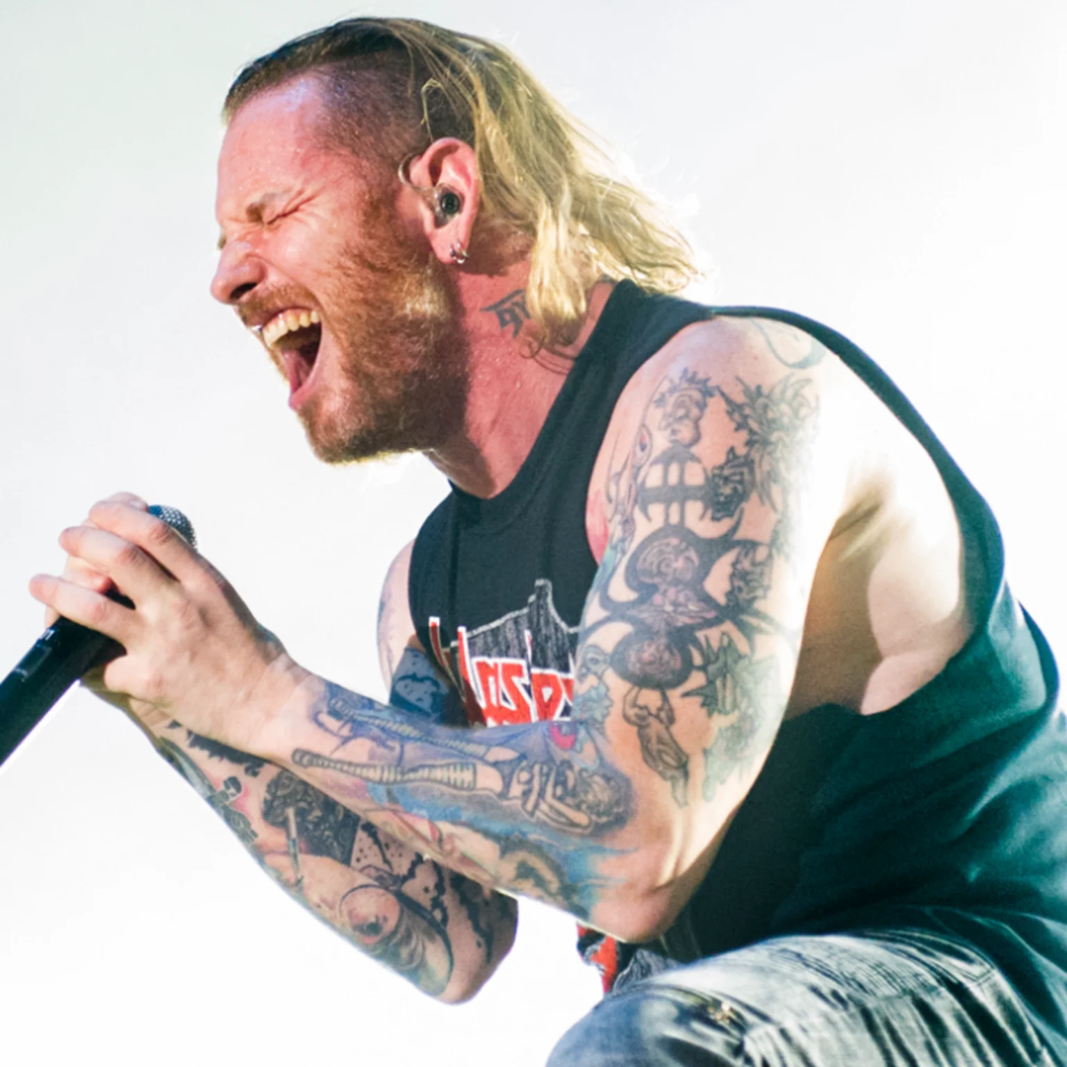 Corey Taylor tattoos: tattooed arms during a live performance