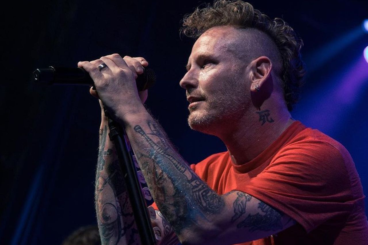Corey Taylor tattoos: neck and arm tattoos during a live performance