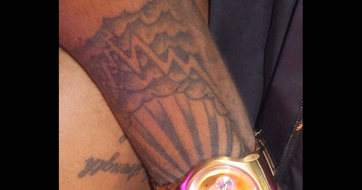 Trey Songz tattoos: Distinct close photograph of the Through the Storm wrist design