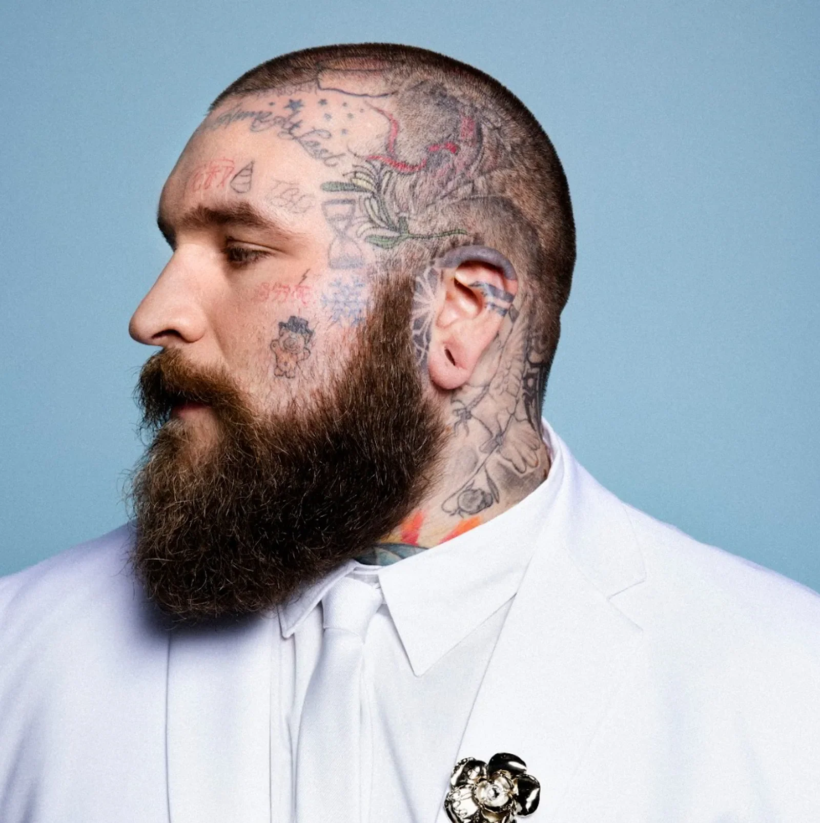 Teddy Swims face and neck tattoos close-up