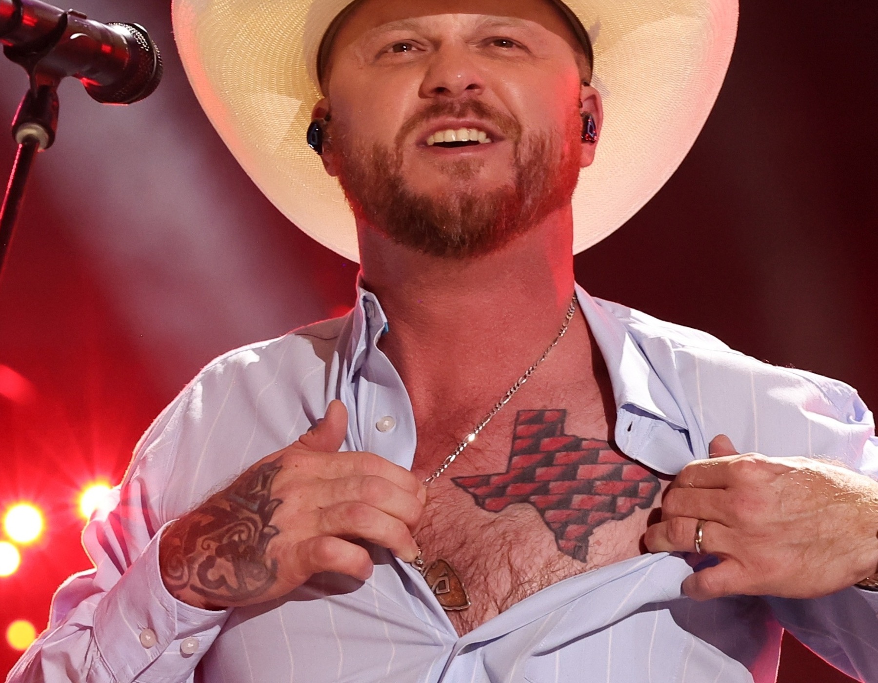 Cody Johnson tattoos: Texas chest map and visible hand tattoo detail