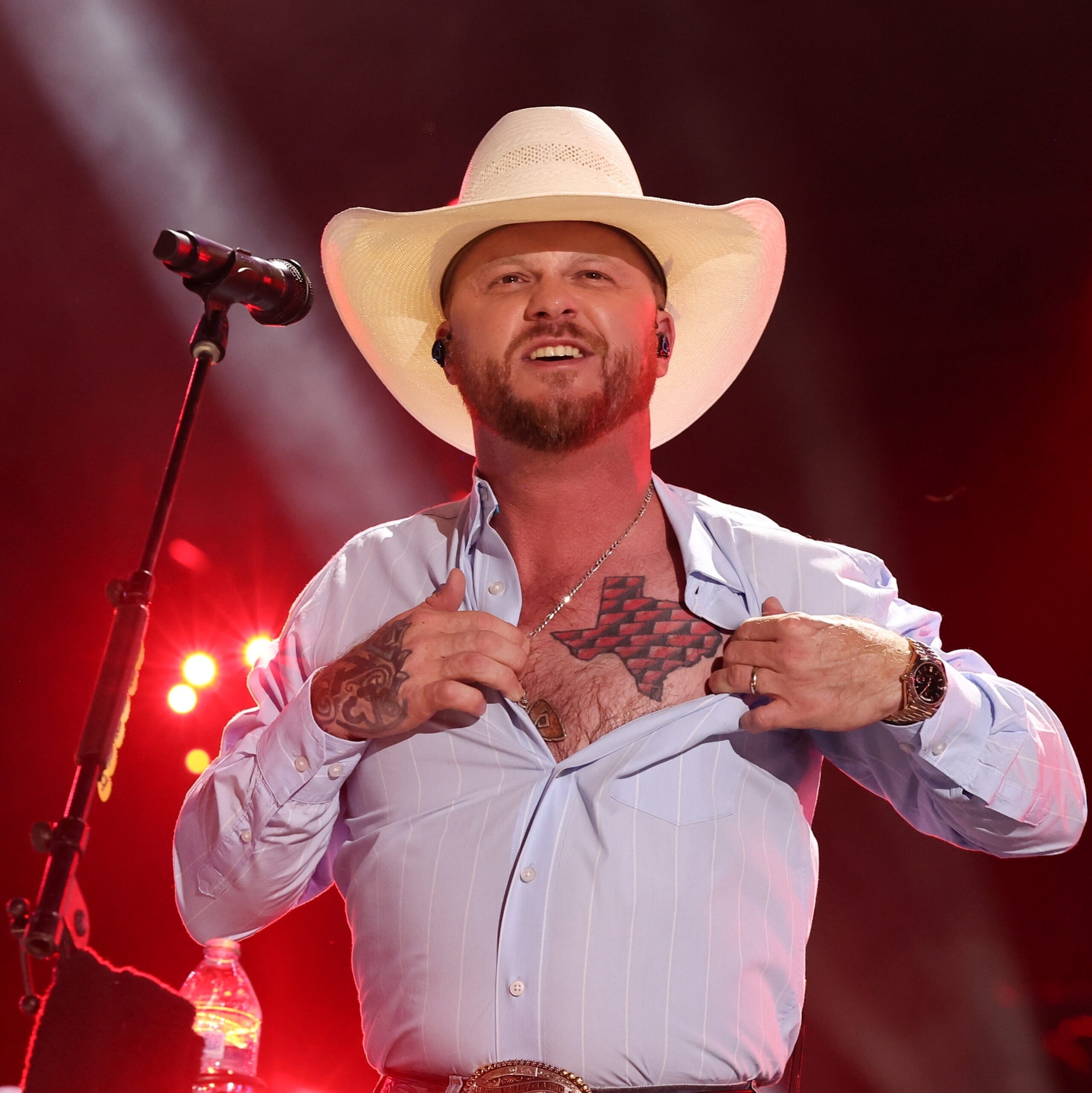 Cody Johnson tattoos: the Texas map chest tattoo and visible hand ink