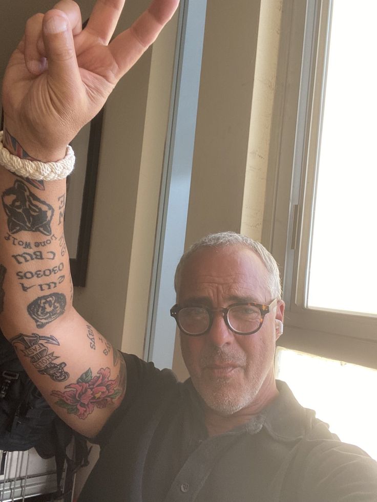 Titus Welliver Silver Surfer arm tattoo