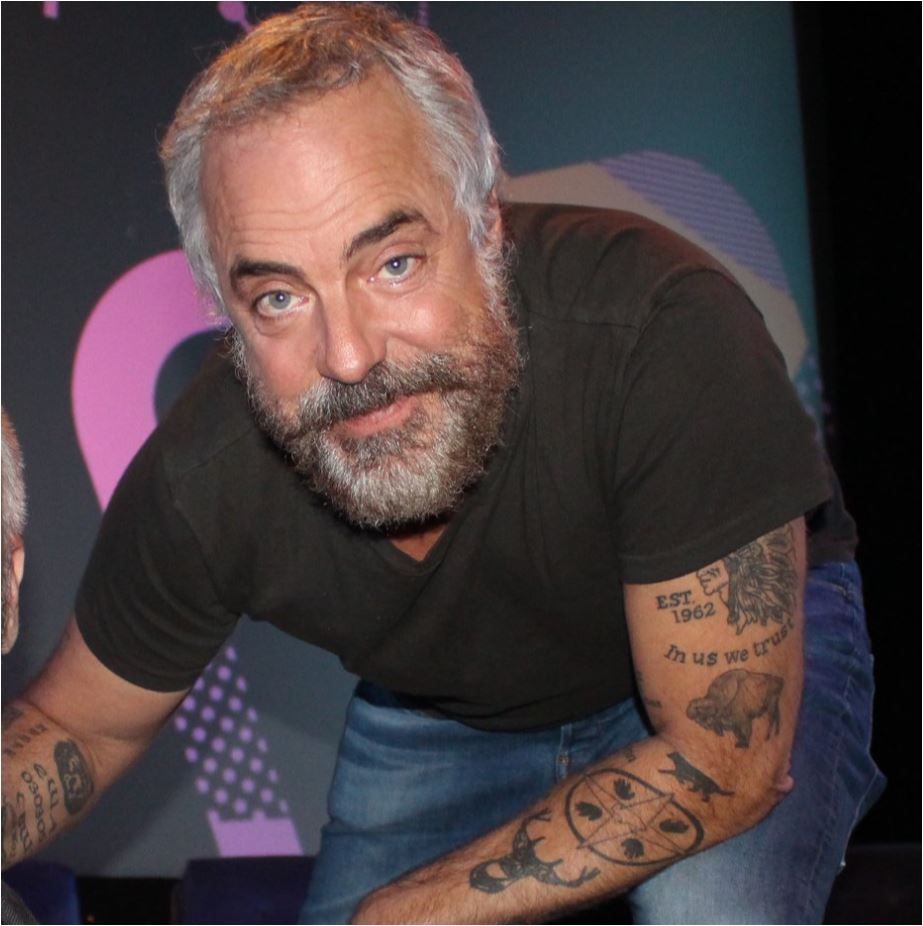 Titus Welliver buffalo EST 1962 arm tattoo