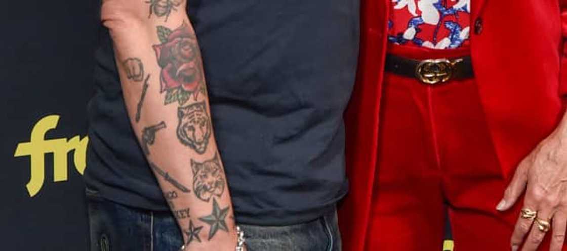Titus Welliver weapons star and forearm tattoos