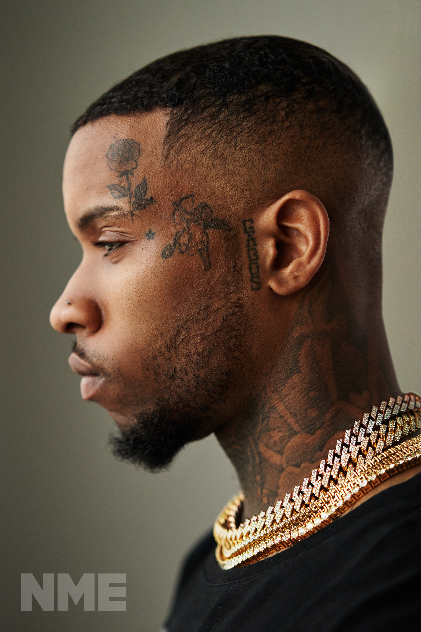 Tory Lanez profile face tattoos