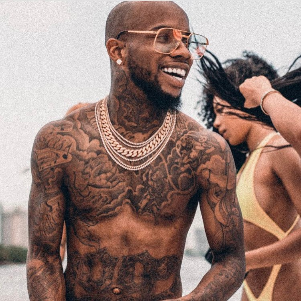Tory Lanez torso and arm tattoos