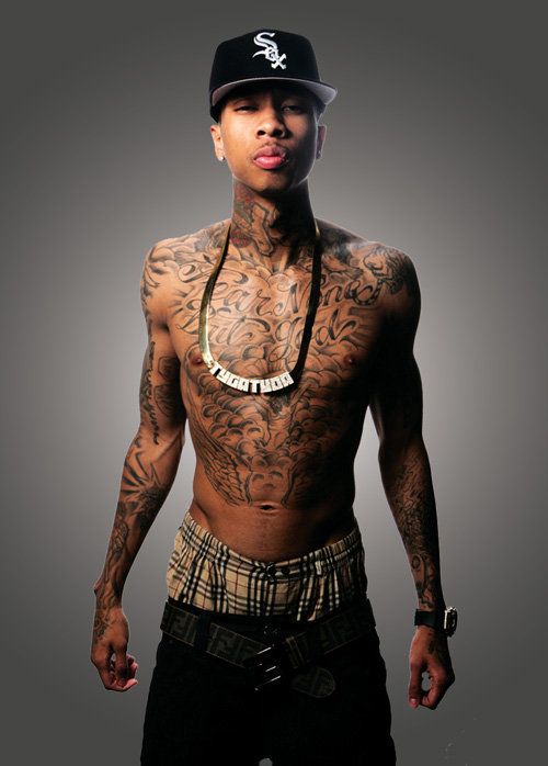 Tyga chest and upper arm tattoos