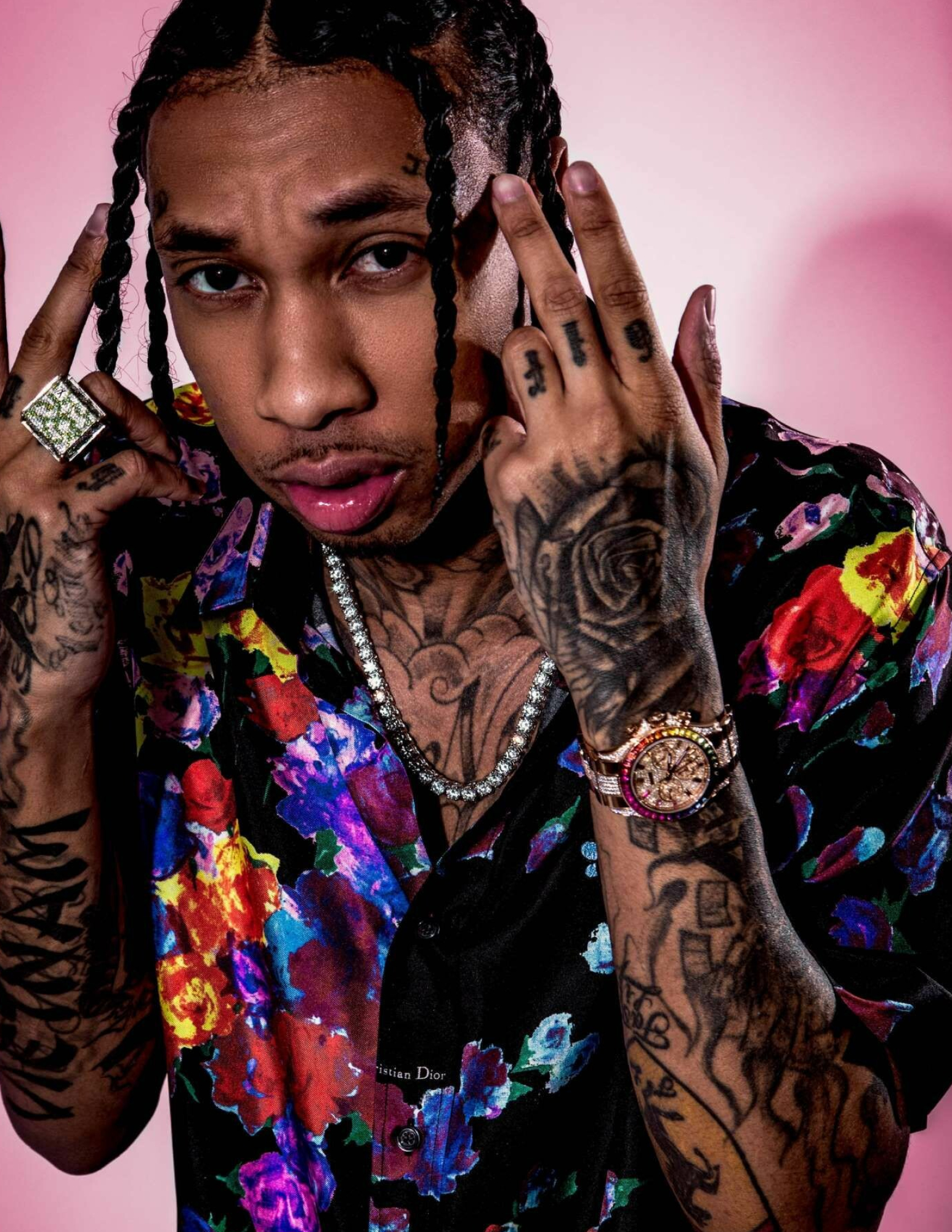 Tyga hand and rose tattoos