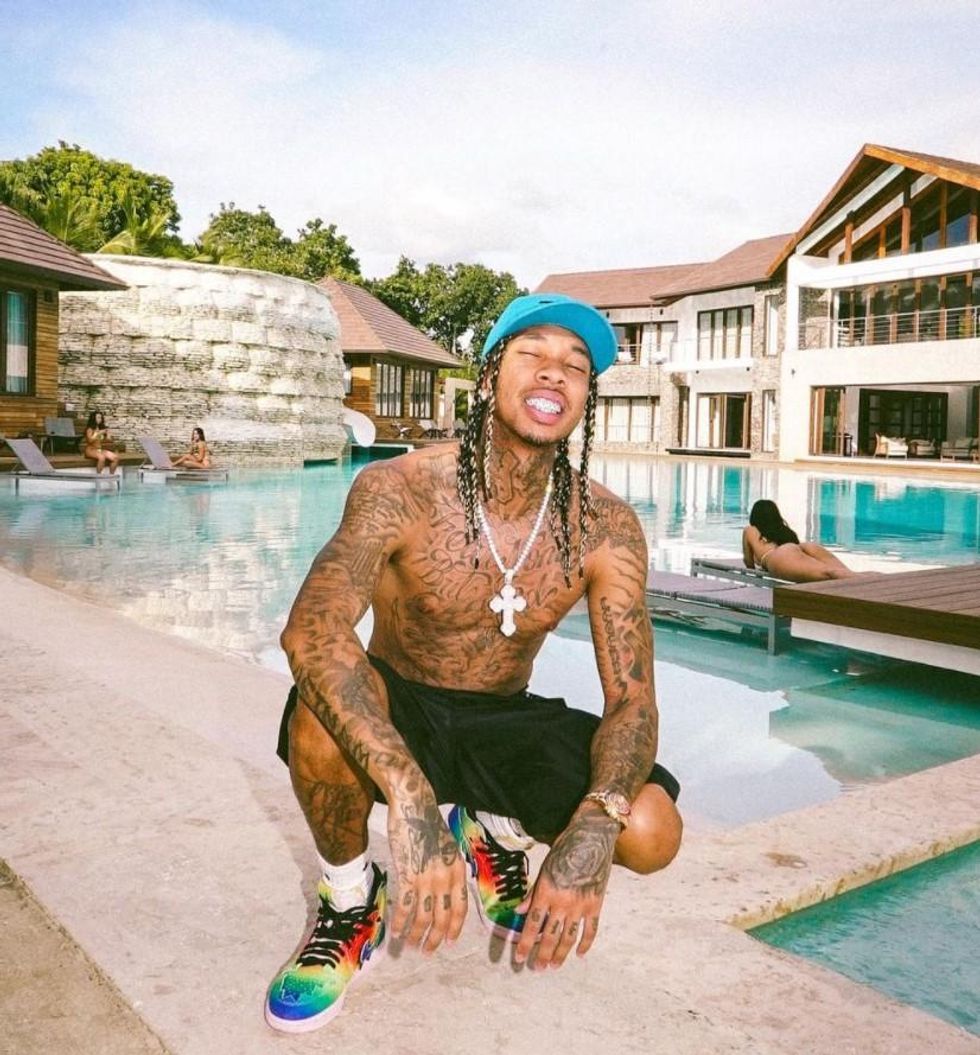 Tyga poolside torso tattoos