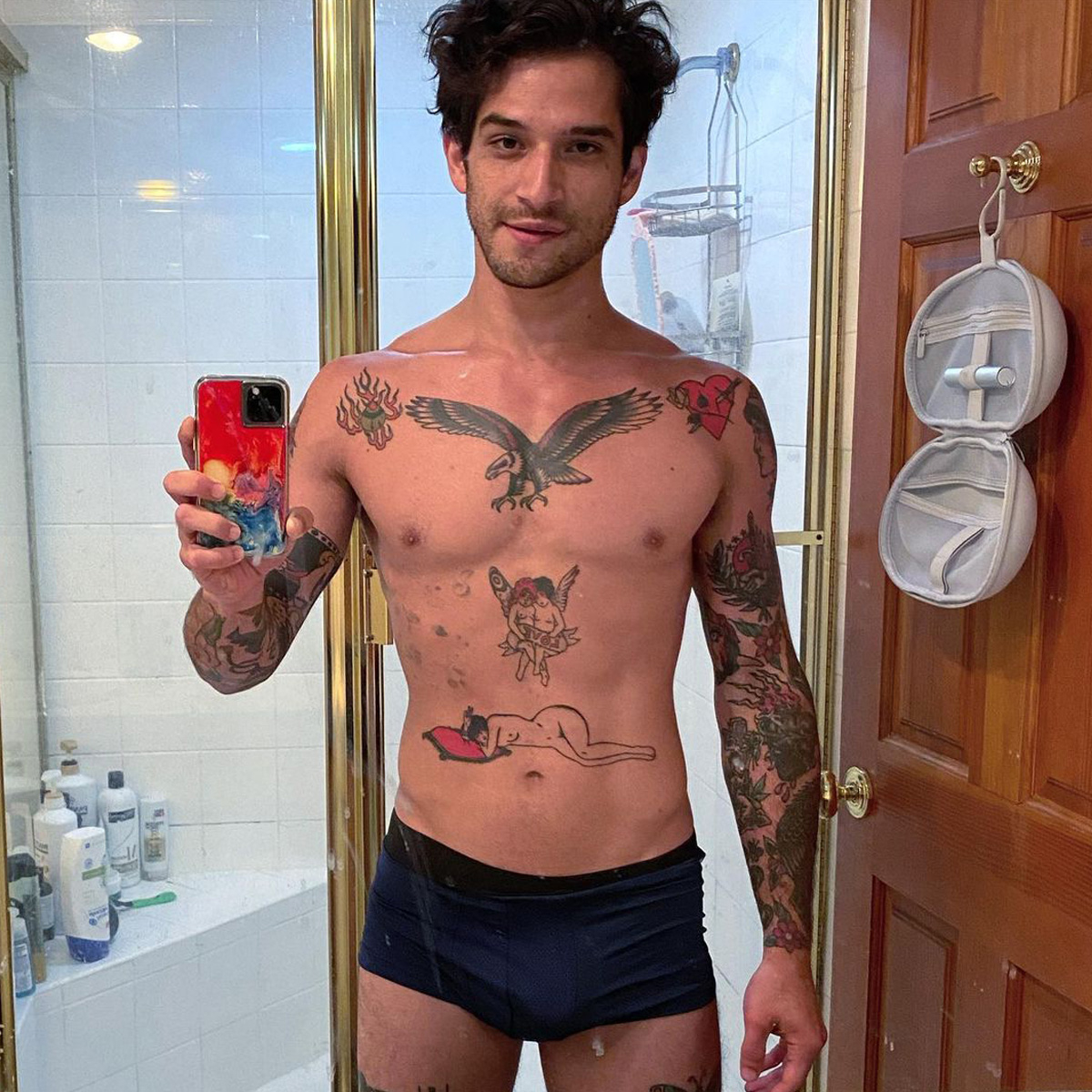 Tyler Posey eagle chest and sleeve tattoos