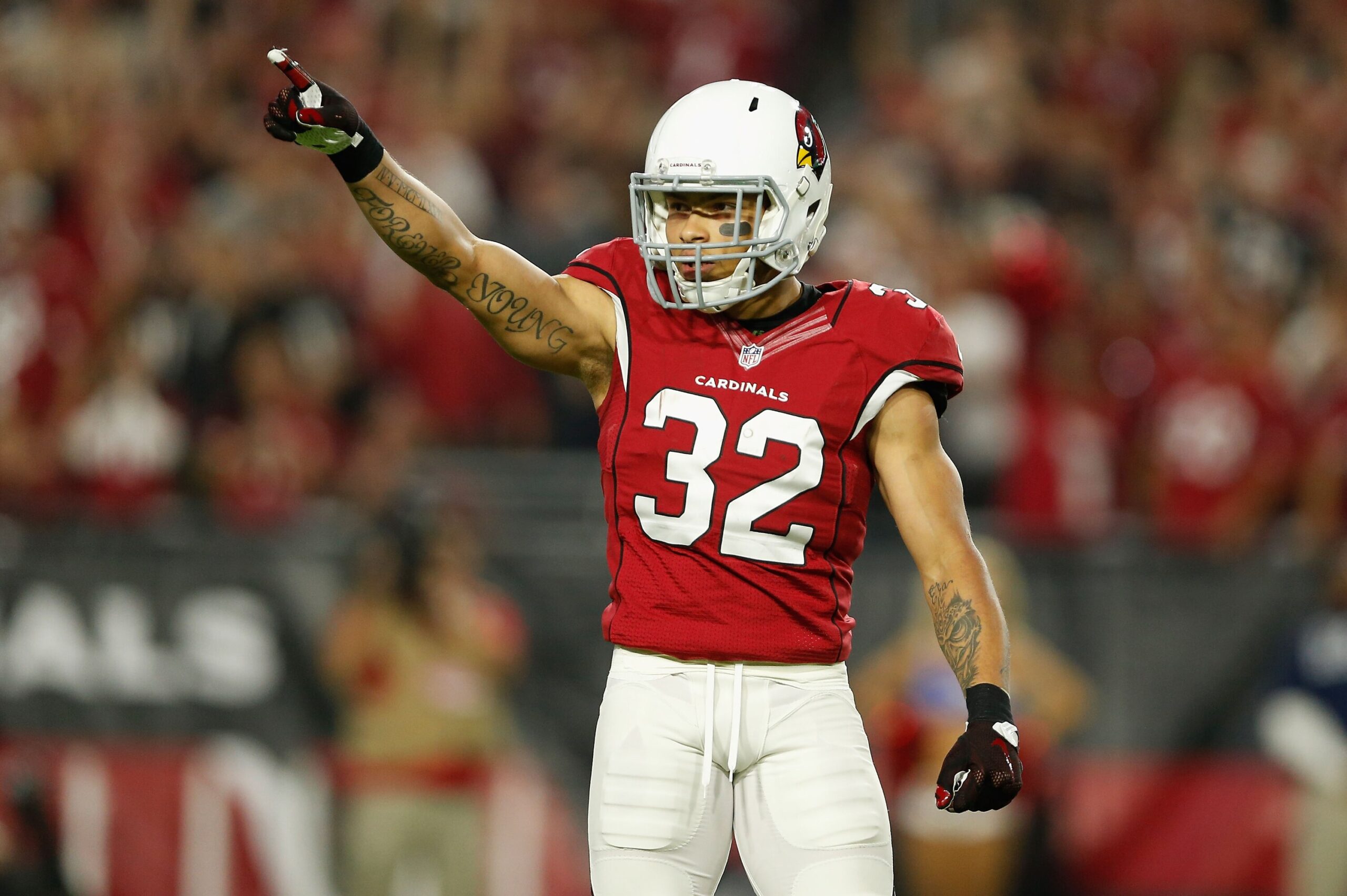 Tyrann Mathieu memorial crosses and initials tattoos