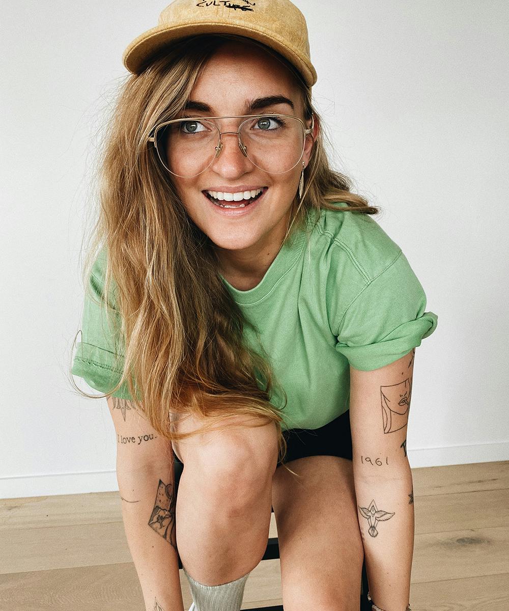 G Flip tattoos: clear portrait showing lettering and small arm designs