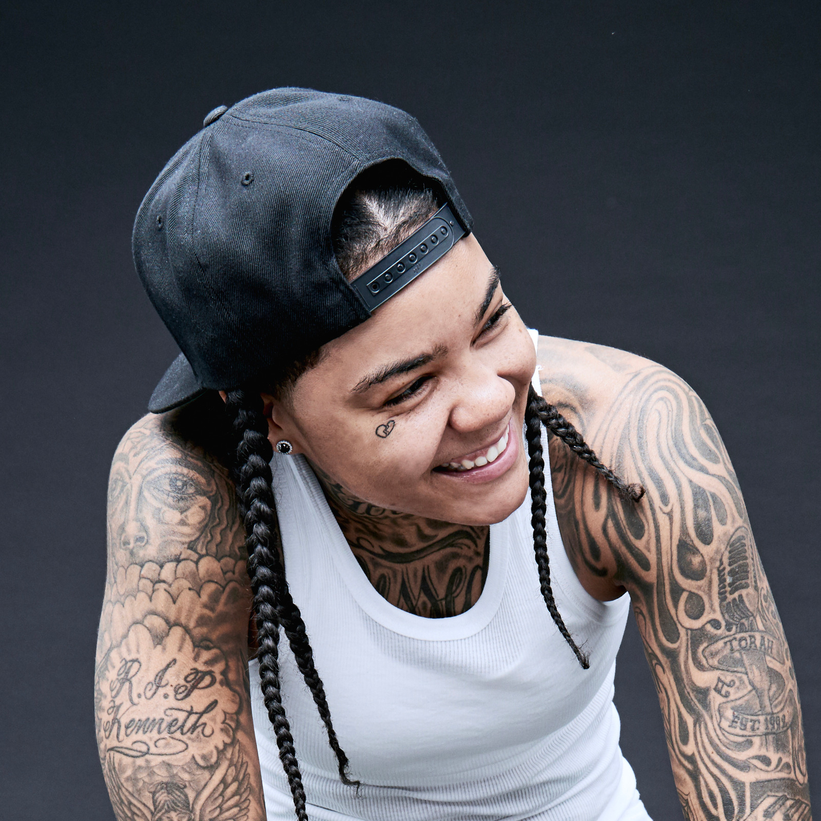 Young M.A arm and chest tattoos