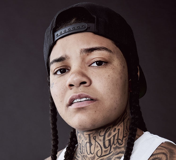 Young M.A script neck tattoo