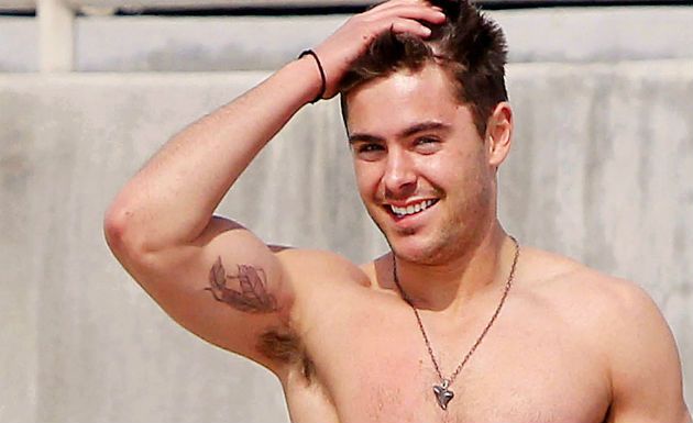 Zac Efron’s double-feather tattoo on the inside of his right bicep