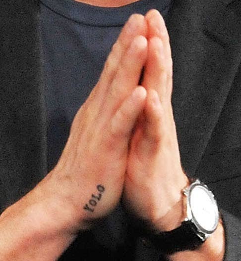 Zac Efron’s YOLO tattoo on his right hand