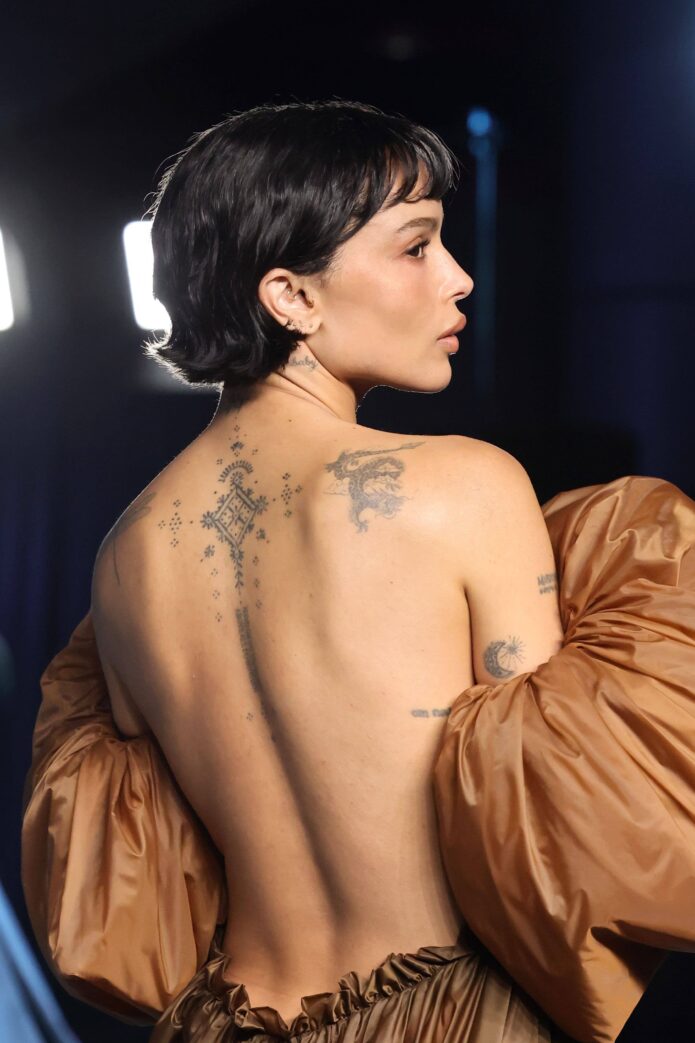 Zoe Kravitz showing the dragonfly shoulder tattoo